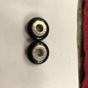 2 Storywheels charms.